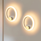 Two circular wall lights on a neutral background