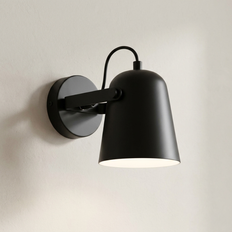Black wall-mounted lamp on a neutral background