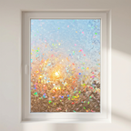 Decorative window film with colorful geometric pattern on a white window frame.