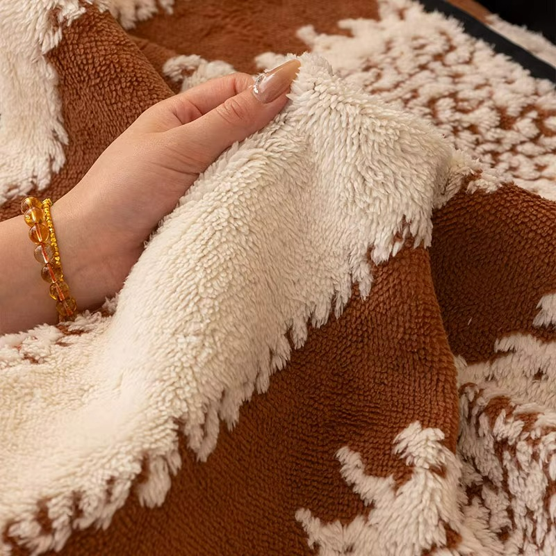 Close-up of a hand holding a textured beige fabric against a brown and beige patterned background.