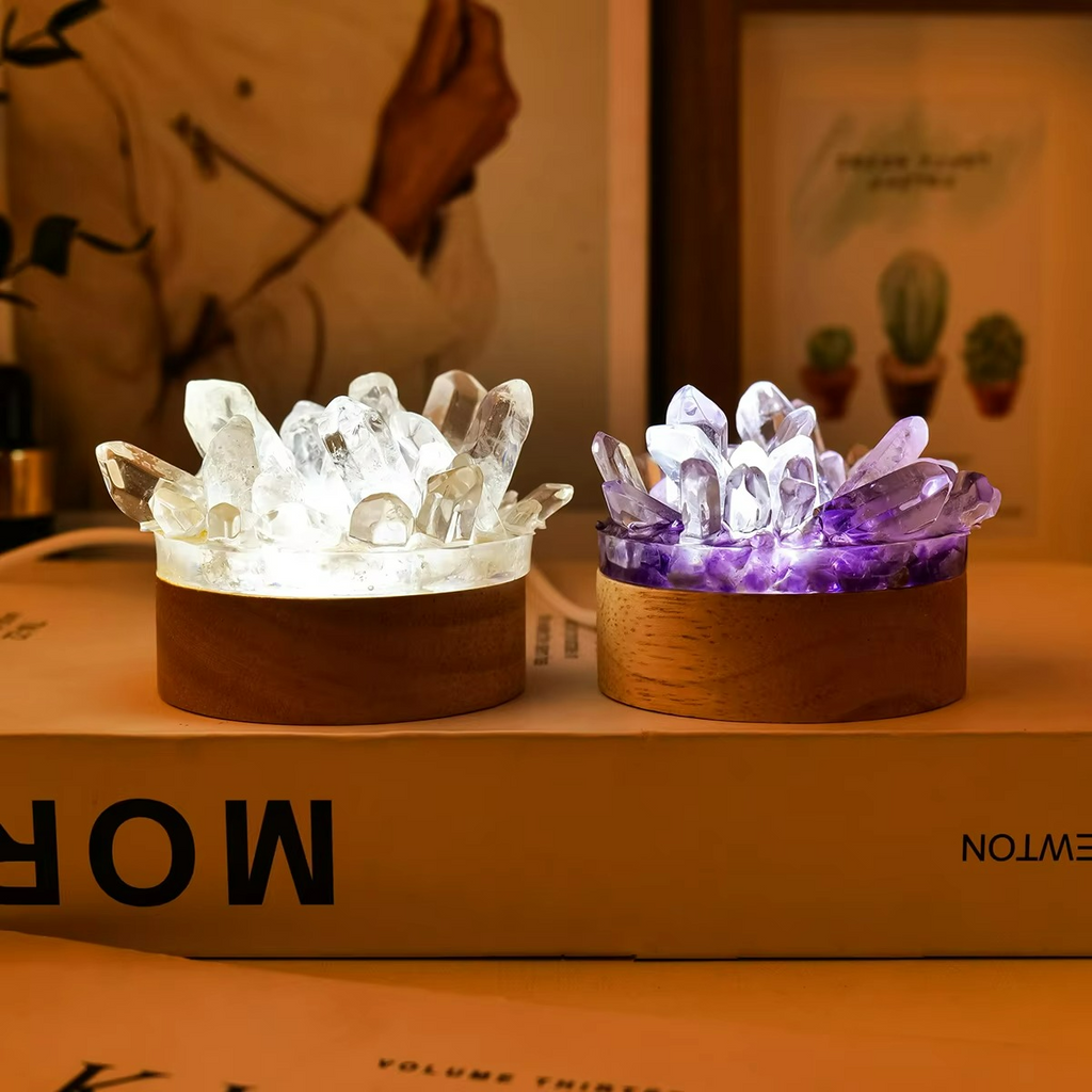 Two crystal-themed night lights on a surface with a blurred background