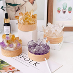 Decorative crystal sets on a table with a magazine and a bottle of serum.