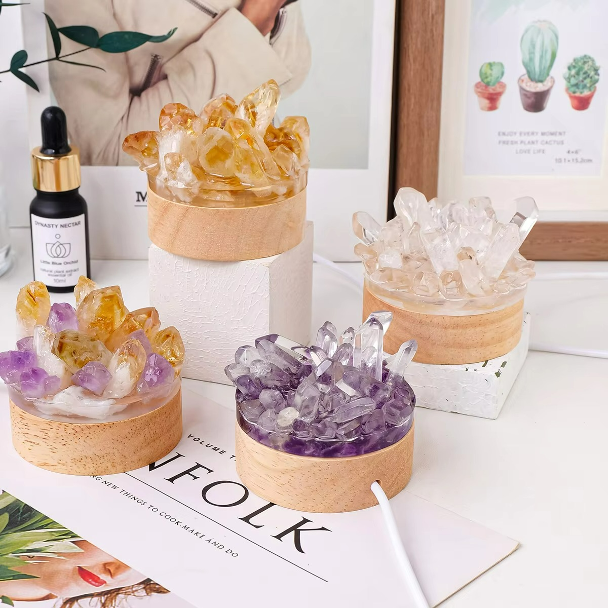 Decorative crystal sets on a table with a magazine and a bottle of serum.