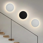 Modern wall lights on a staircase with a neutral background