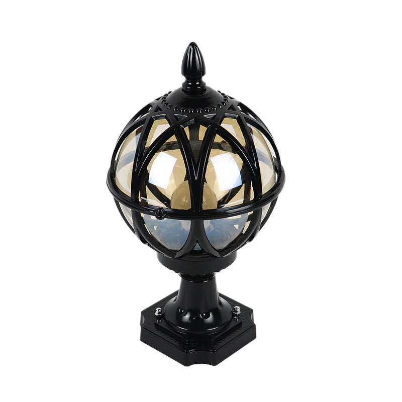 Decorative outdoor lamp with black metal and glass design on a white background