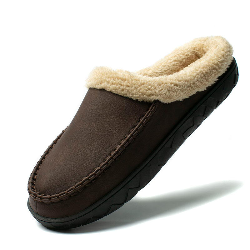Brown slipper with beige fur lining on a white background