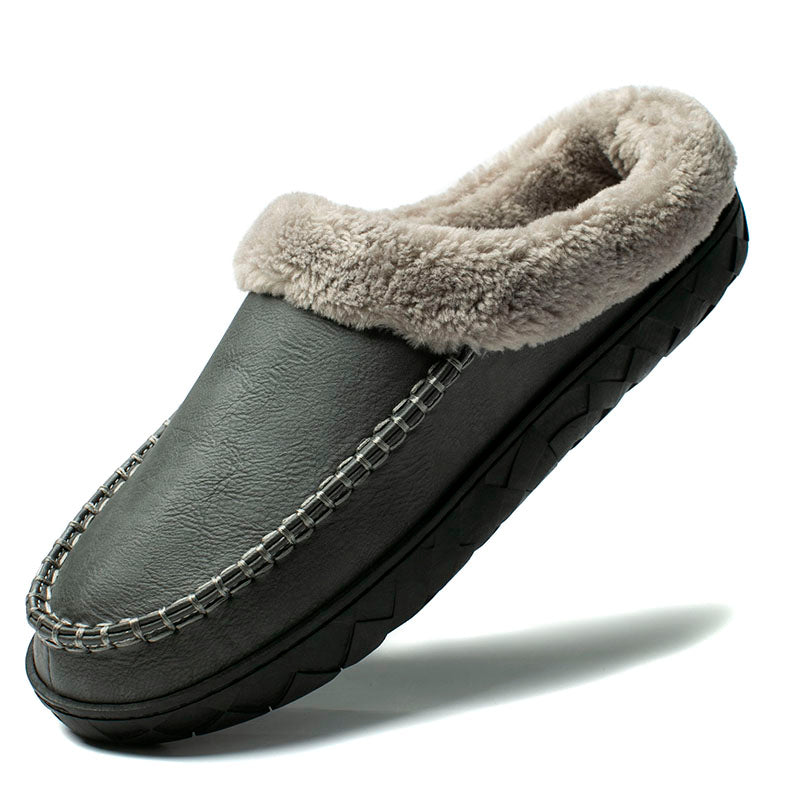 Gray slipper with fuzzy lining on a white background