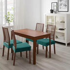 Dining room with wooden table and chairs in a home setting