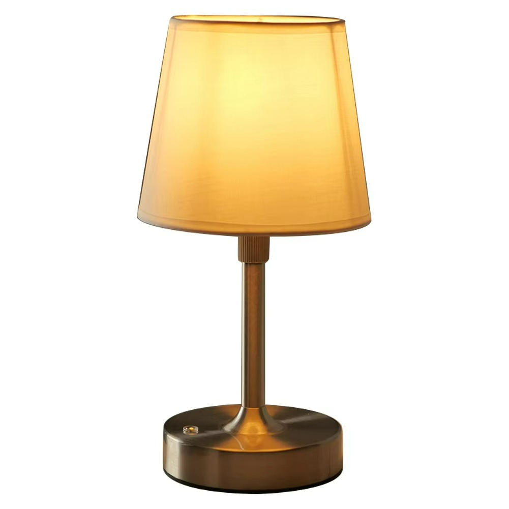 Table lamp with a gold shade and base on a white background