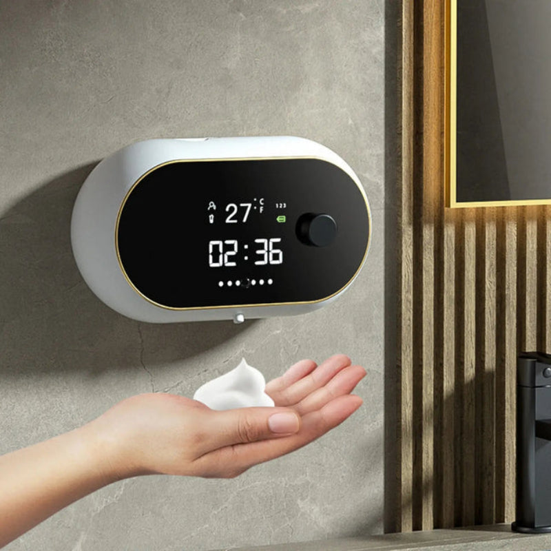 Digital temperature and time display on a wall with a hand holding a tissue.