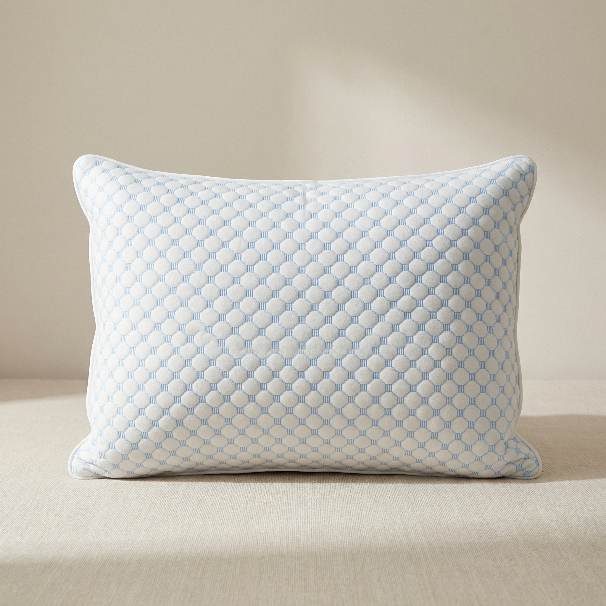 Patterned pillow on a beige sofa
