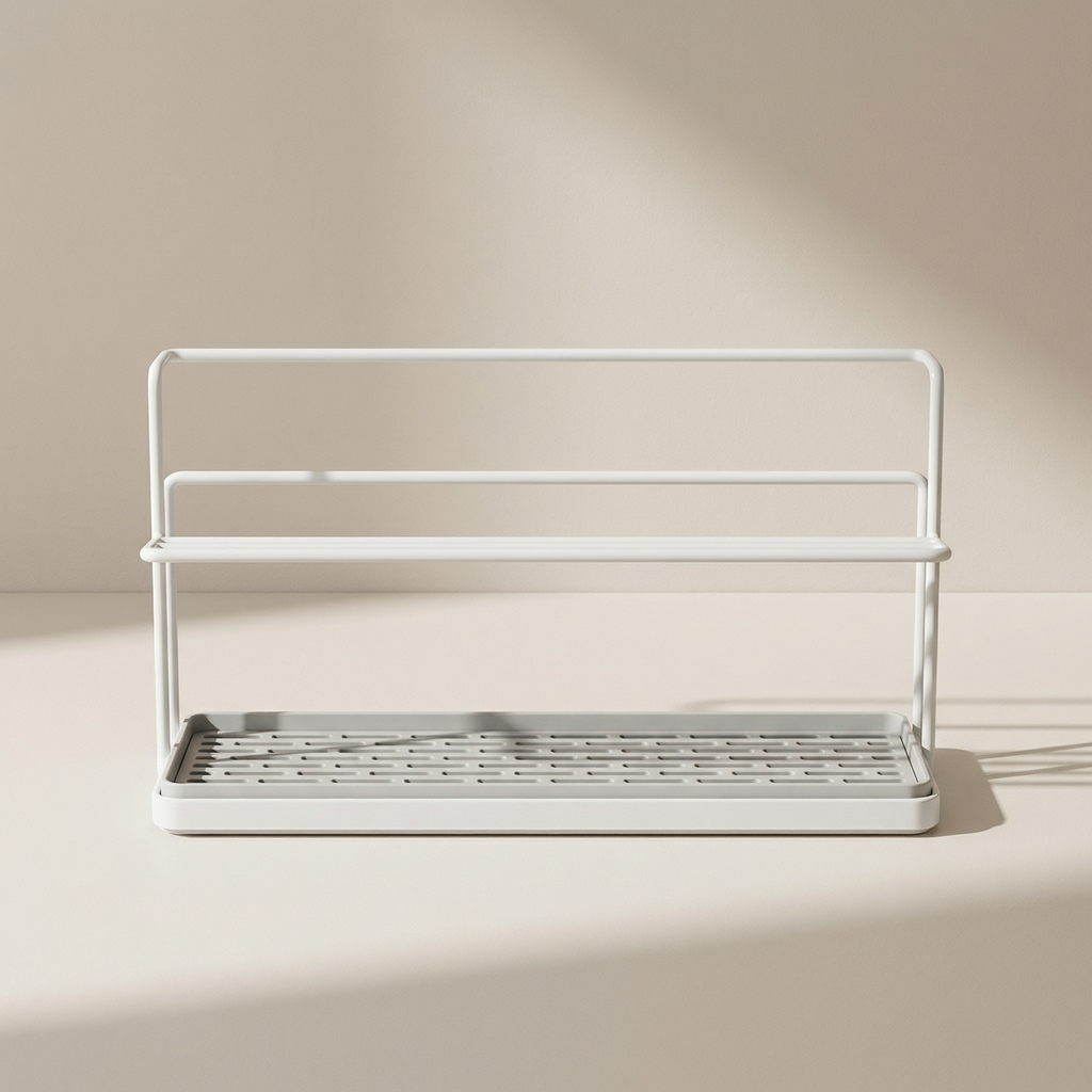 White metal dish rack with a tray on a beige background