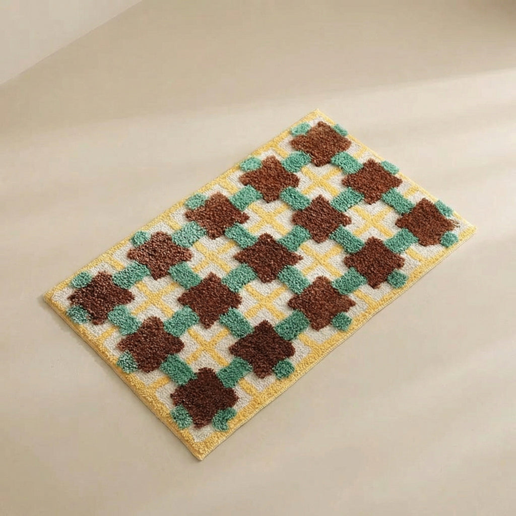 Checkered doormat with brown and green pattern on a beige background
