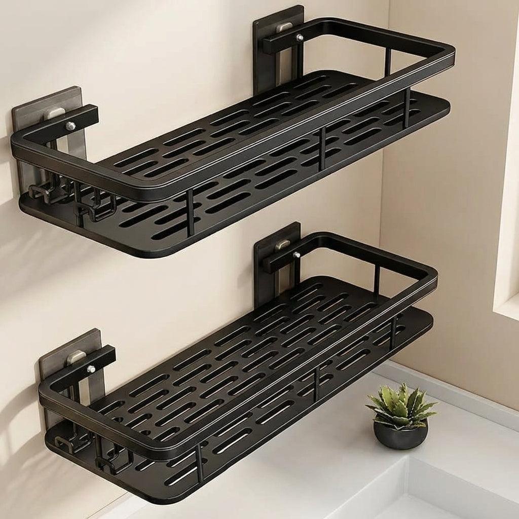 Two black wall-mounted shelves in a bathroom setting with a small plant.