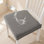 Gray textured chair pad on a white chair with water droplet graphic