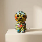 Colorful stained glass dog figurine on a beige surface with a beige background