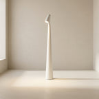 White floor lamp on a neutral background
