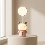 Cute pink lamp with animal ears on a white surface near a window