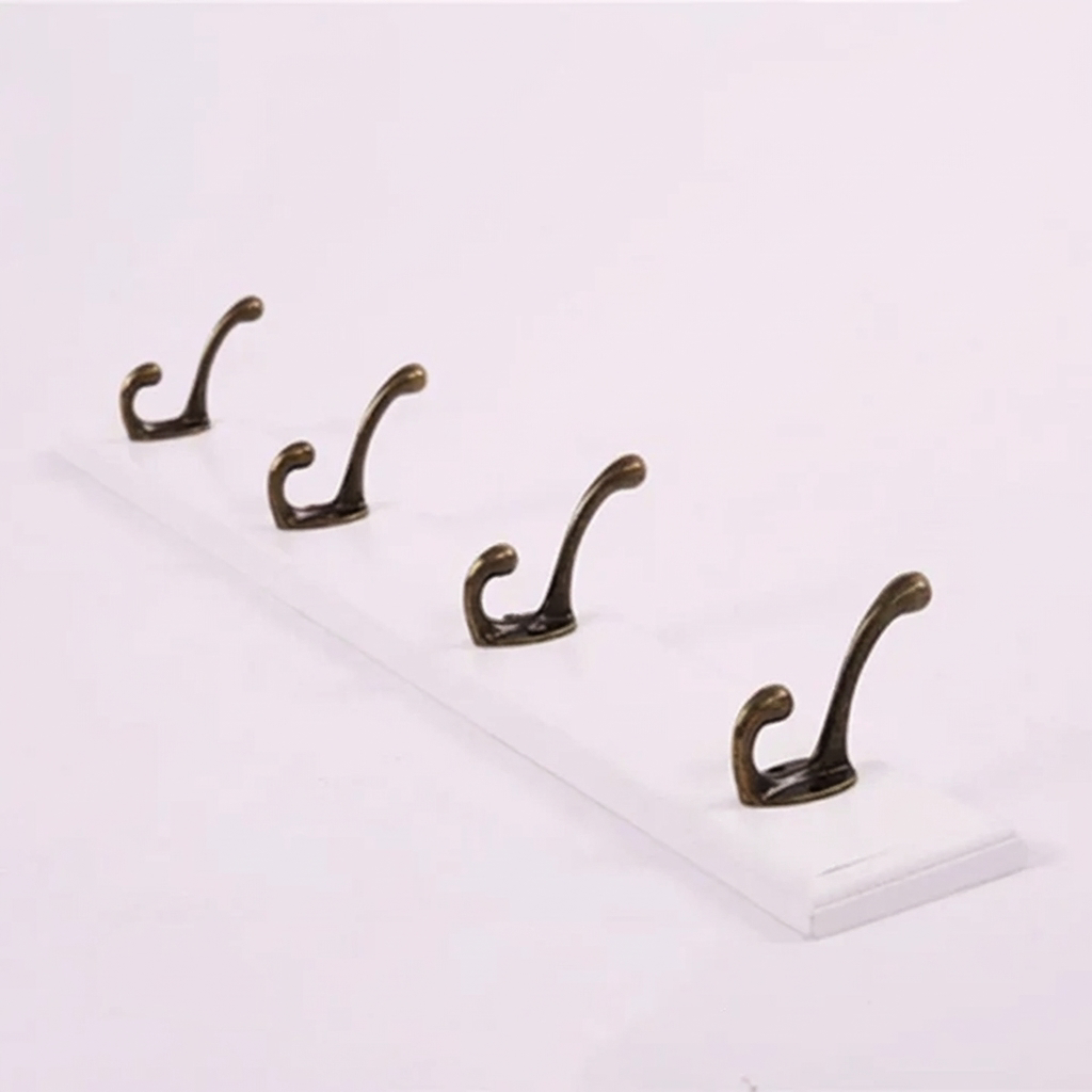 Set of four bronze hooks on a white background