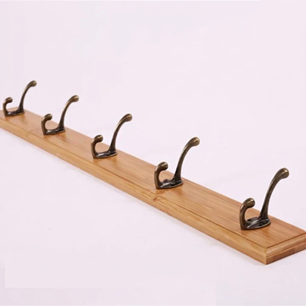 Wooden rack with six metal hooks on a white background