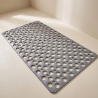 Gray perforated mat on a light beige floor