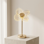 Decorative table lamp with a flower-shaped design on a neutral background