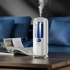 White humidifier emitting steam on a wooden table with a blue couch in the background