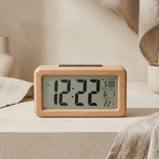 Digital clock with wooden frame on a neutral background