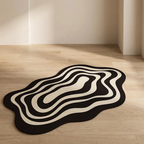 Black and white abstract rug on a wooden floor