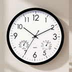 Wall clock with temperature and humidity indicators on a plain background