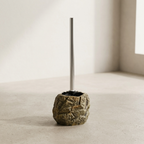 Toilet brush with stone base on a light beige background