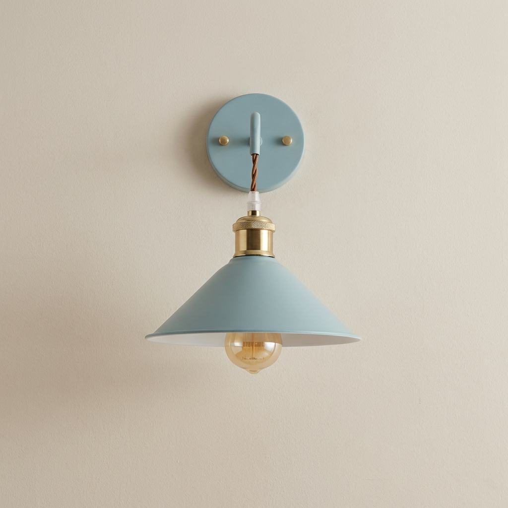 Wall-mounted light fixture with a blue shade and gold bulb on a beige wall.