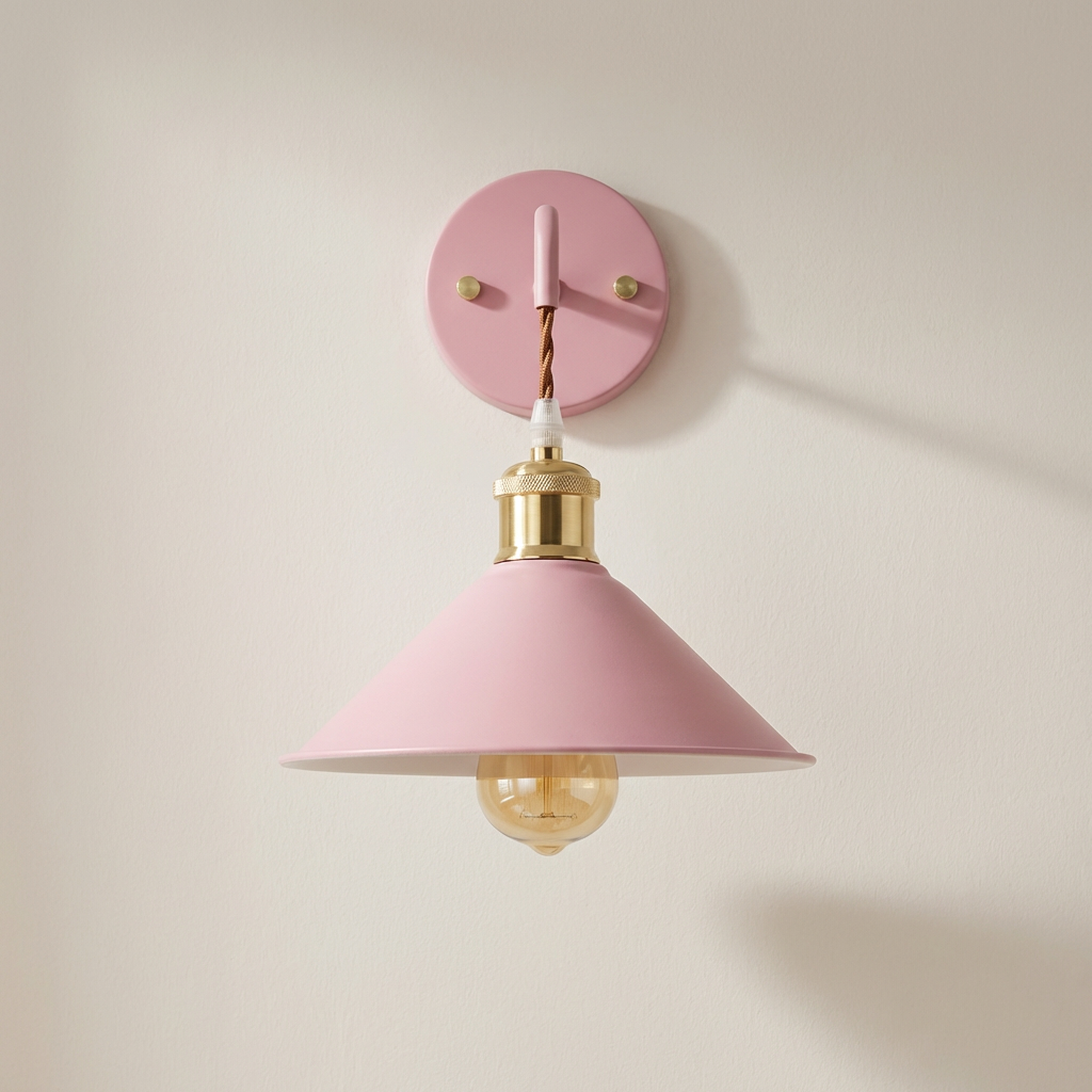 Pink wall lamp with gold accents on a light pink background