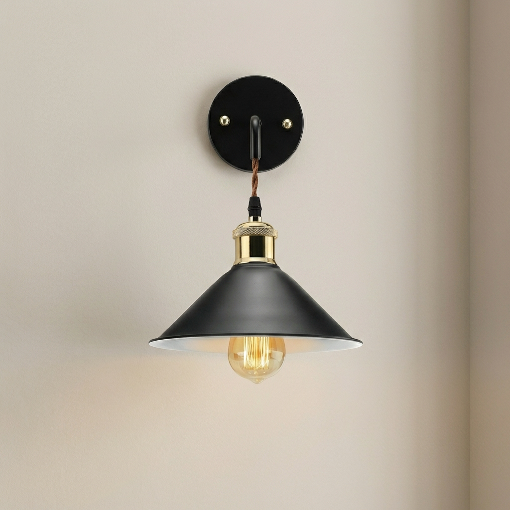 Wall-mounted lamp with black shade and gold accents on a beige background