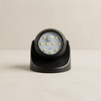 Black motion sensor light on a beige background