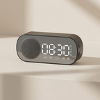 Digital clock with speaker on a beige background