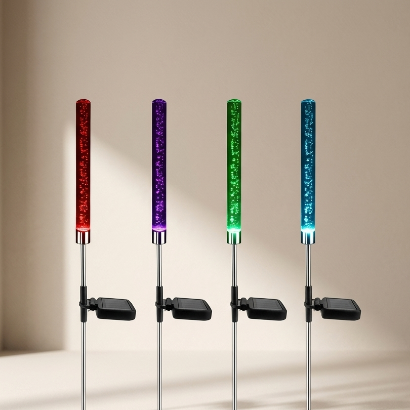 Four LED foam sticks in red, purple, green, and blue on a beige background