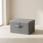 Gray storage box with a lid on a light beige surface.