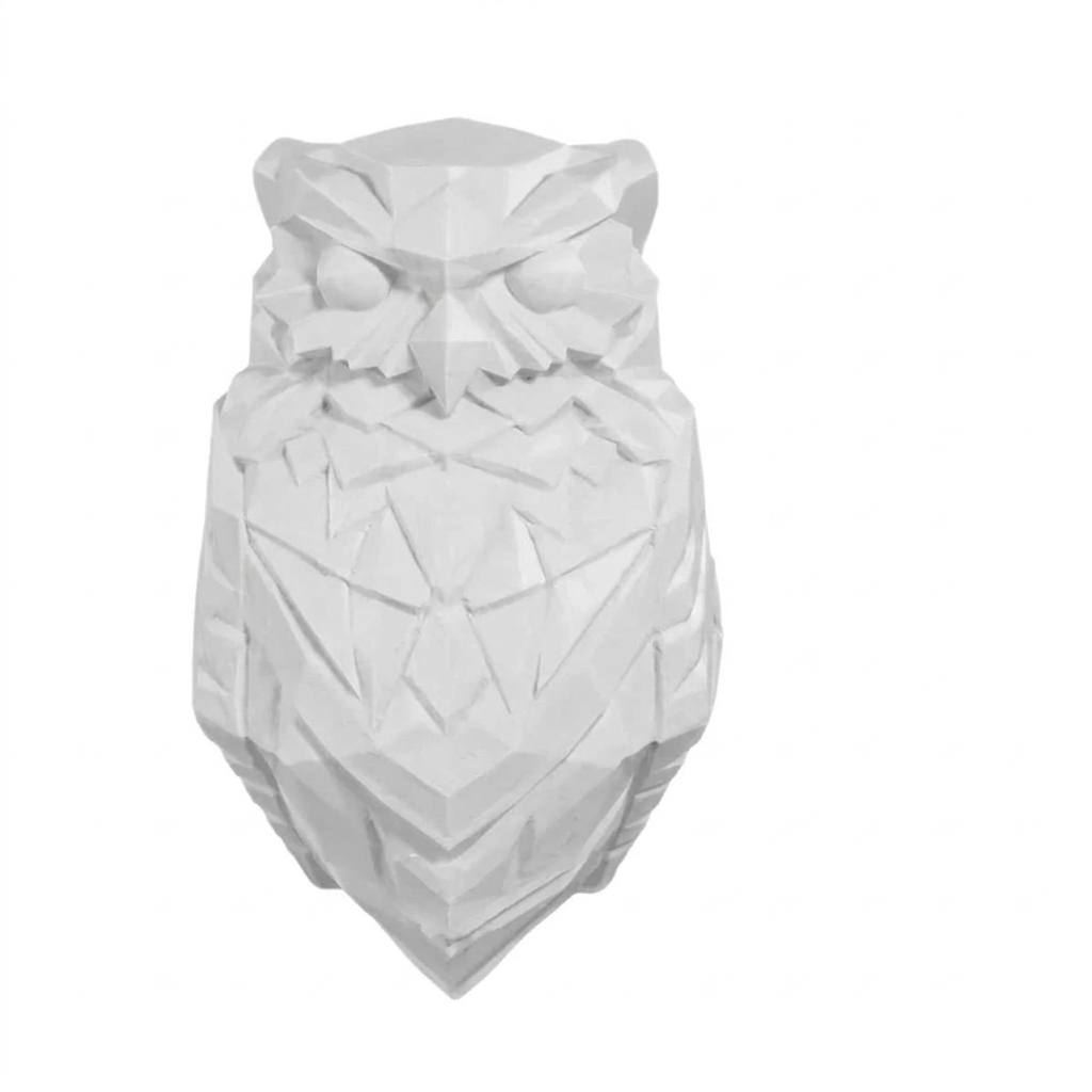 White owl-shaped object on a white background