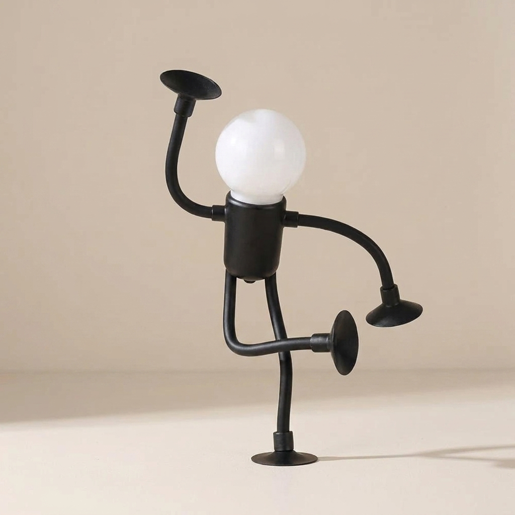 Black metal lamp shaped like a person with a light bulb for a head on a beige background