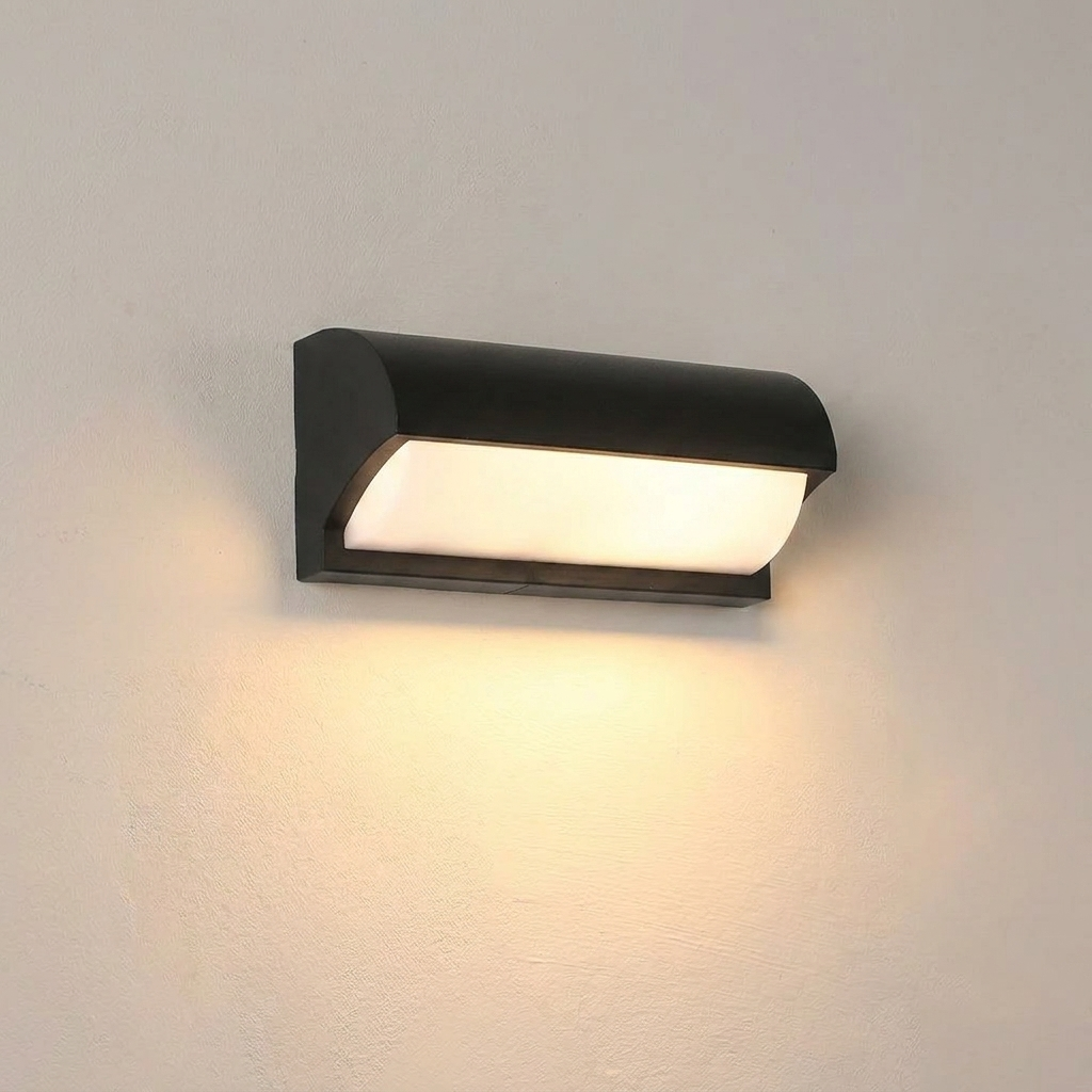 Black outdoor wall light fixture on a gray wall