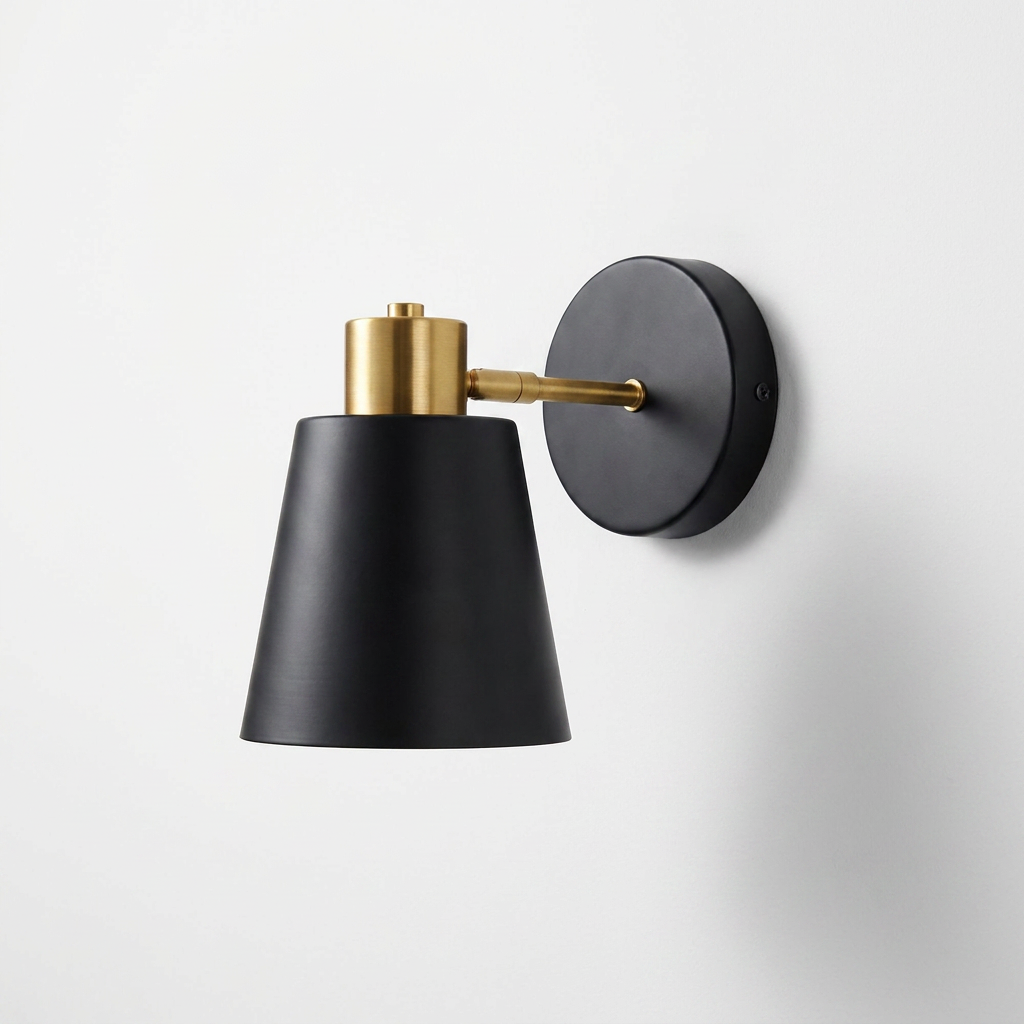 Wall-mounted lamp with black shade and gold accents on a white background