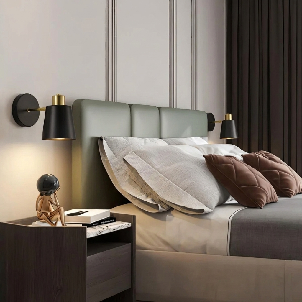 Modern bedroom with a bed, nightstand, and wall sconces.