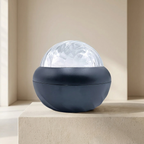 Spherical decorative light on a beige surface with a neutral background