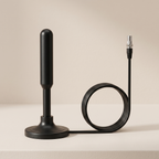 Black antenna with coiled cable on a beige background