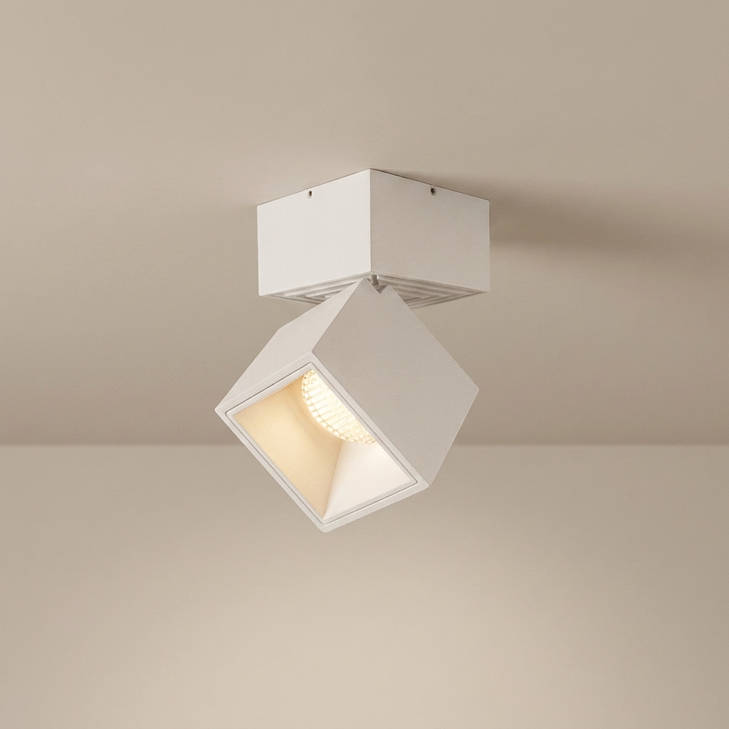 White square ceiling light fixture on a beige ceiling