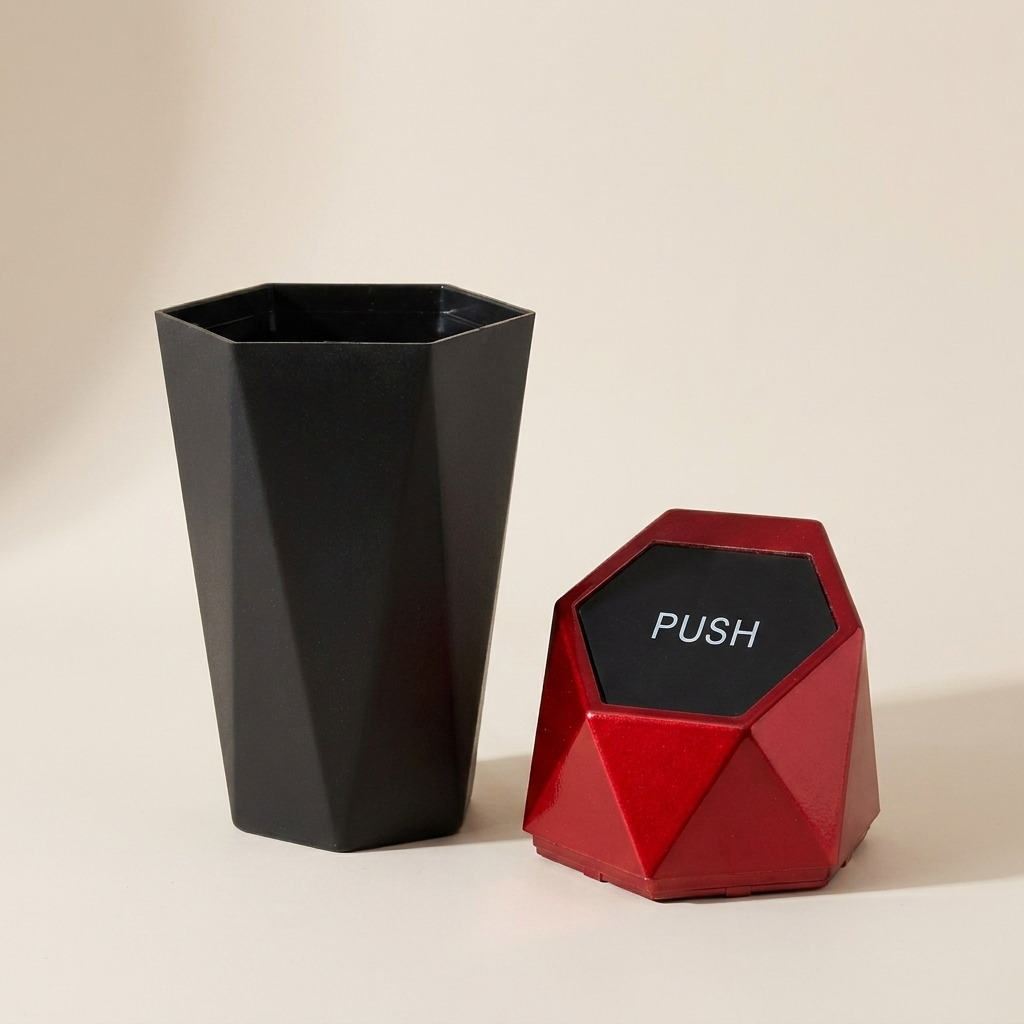 Black geometric vase and red 'PUSH' button on a beige background