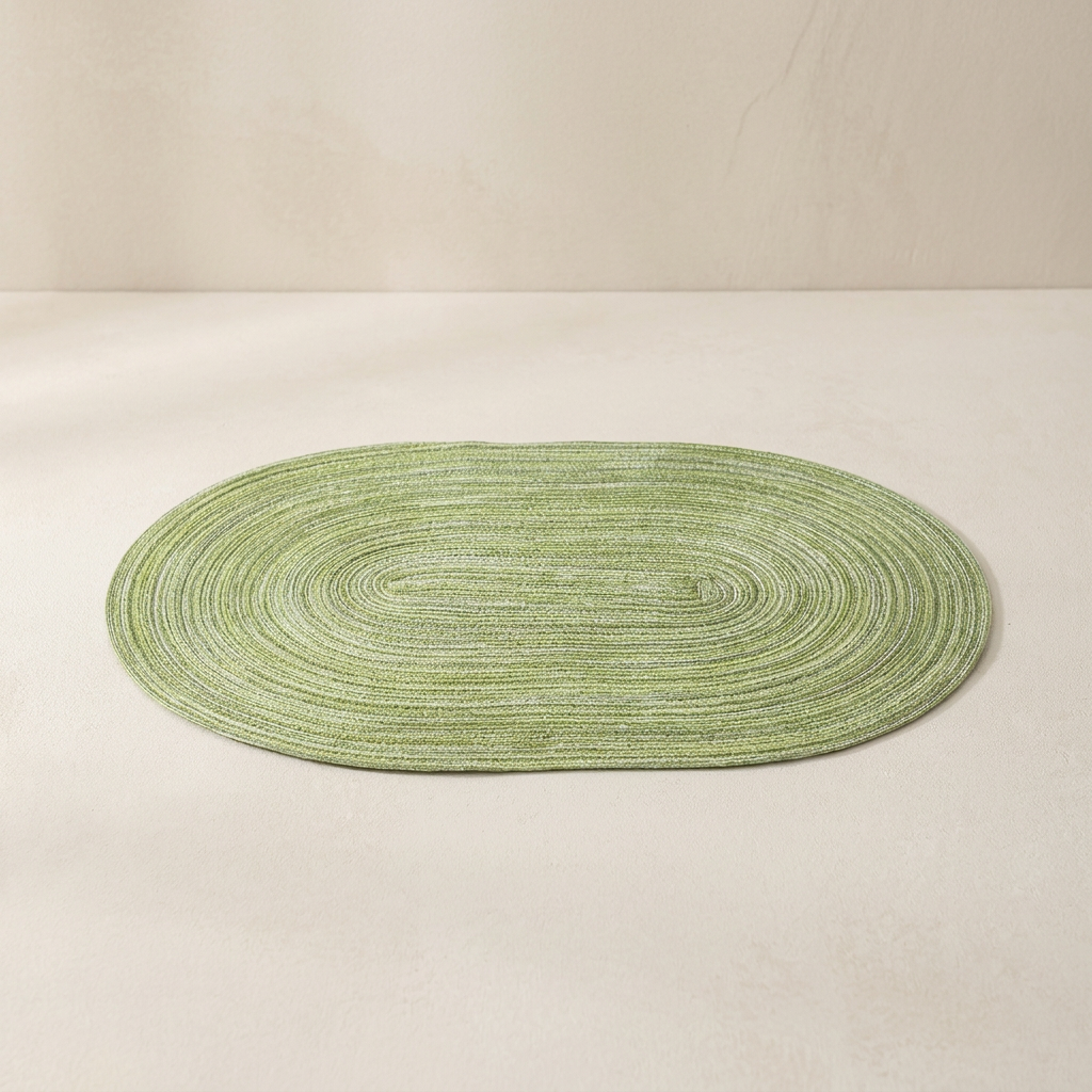 Green oval rug on a beige background