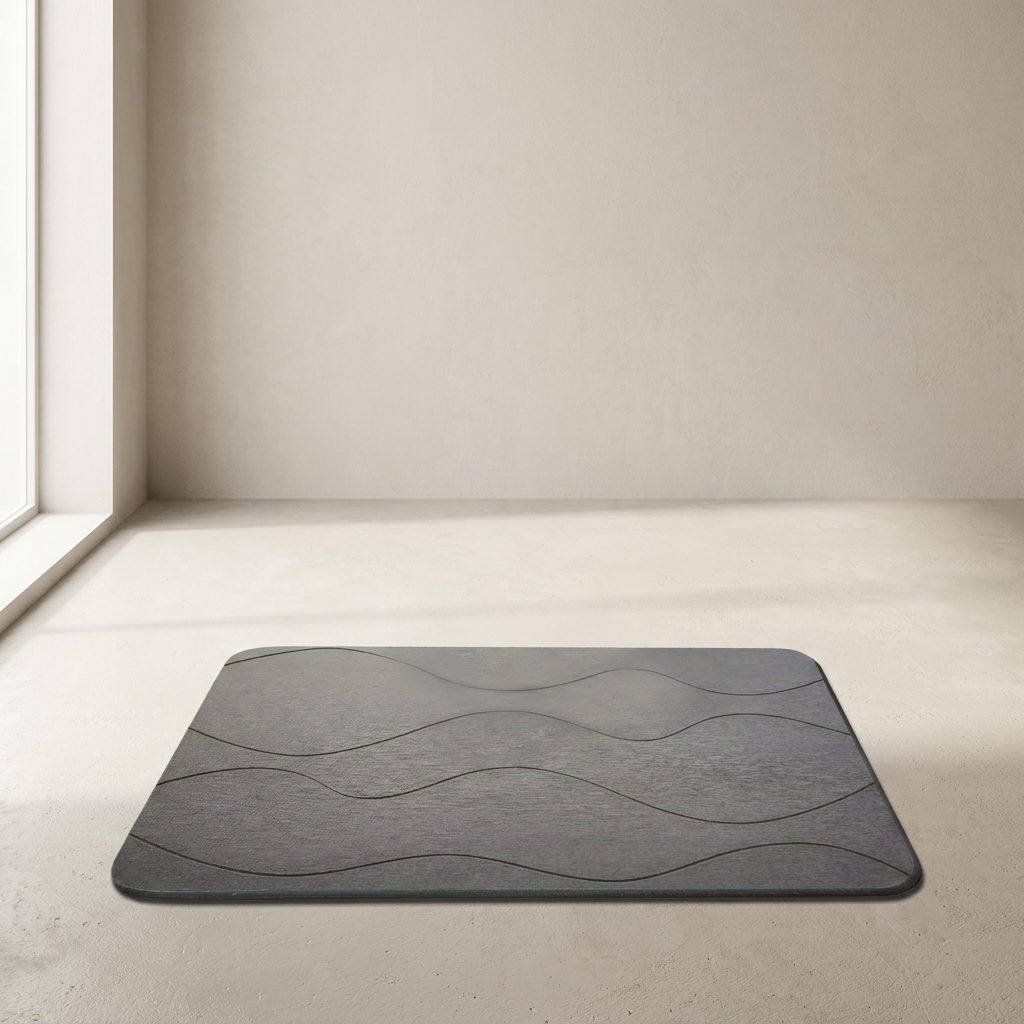 Gray textured mat on a light wooden floor with a neutral wall background