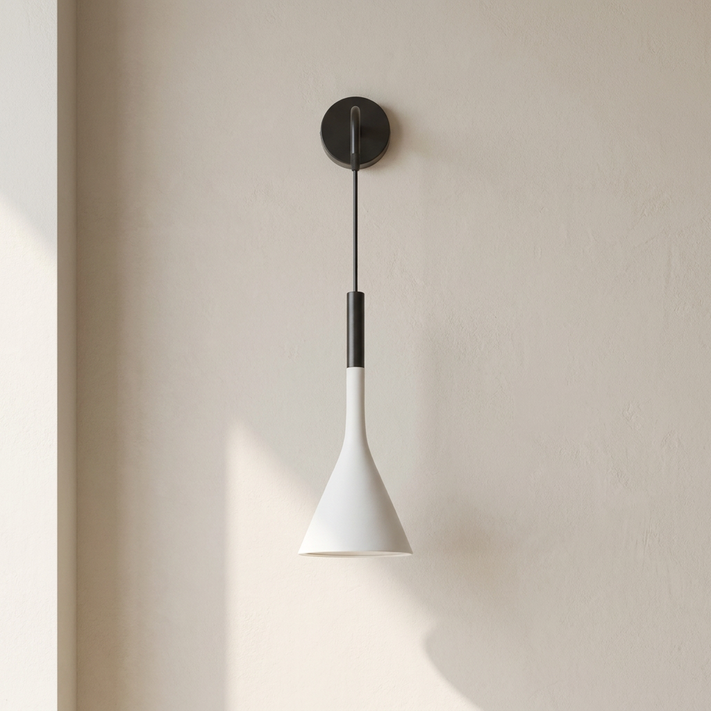 Modern wall-mounted lamp with white cone-shaped shade and black fixture on a neutral wall.